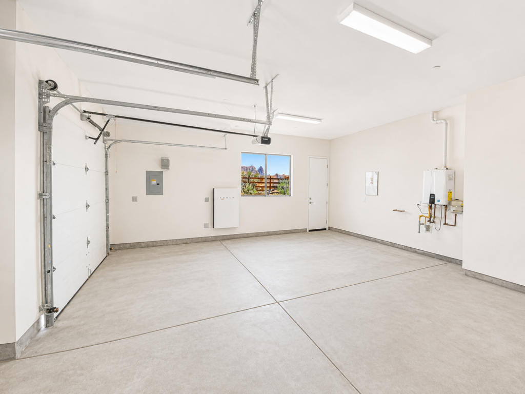 168 garage showing tesla battery and tank-less wtr htr